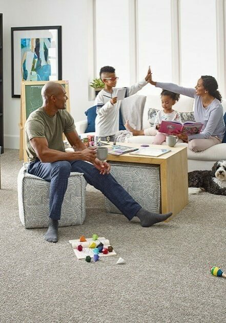 Family enjoying in living room | Floor to Ceiling - Winter Garden